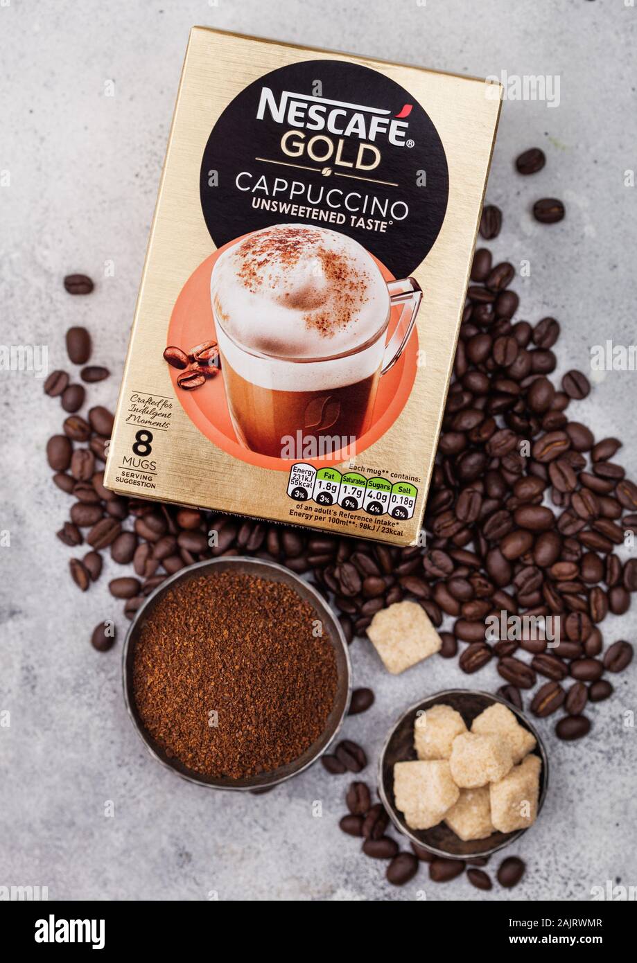 LONDON, UK - AUGUST 15, 2019: Pack of Nescafe Gold Cappuccino unsweetened  taste with coffee beans and sugar cubes on light kitchen background Stock  Photo - Alamy