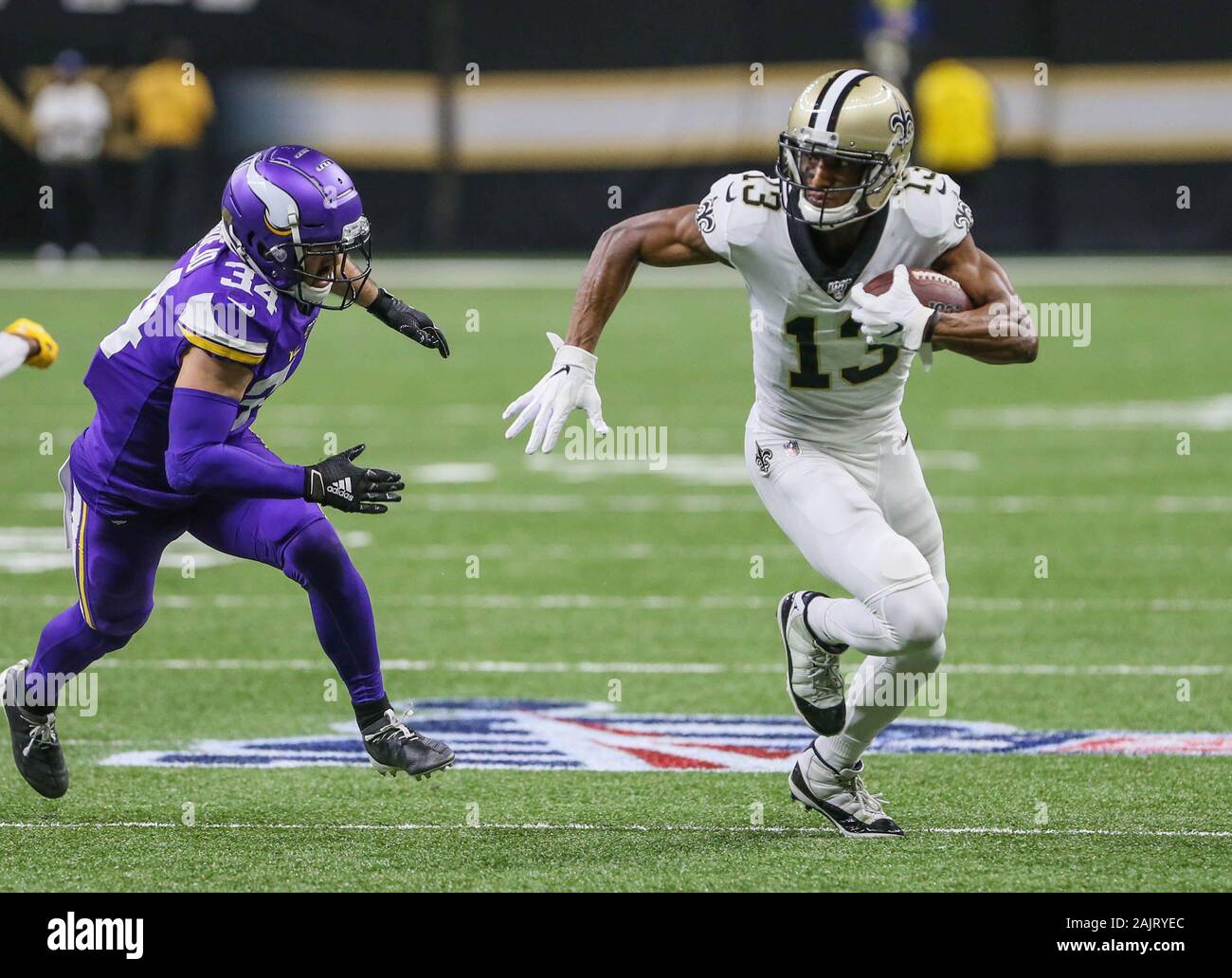 New Orleans, LA, USA. 5th Jan, 2020. New Orleans Saints wide receiver Michael Thomas (13) tries to outrun Minnesota Vikings defensive back Andrew Sendejo (34) during NFL Wild Card Playoff action between the New Orleans Saints and the Minnesota Vikings at the Mercedes Benz Superdome in New Orleans, LA. Jonathan Mailhes/CSM/Alamy Live News Stock Photo