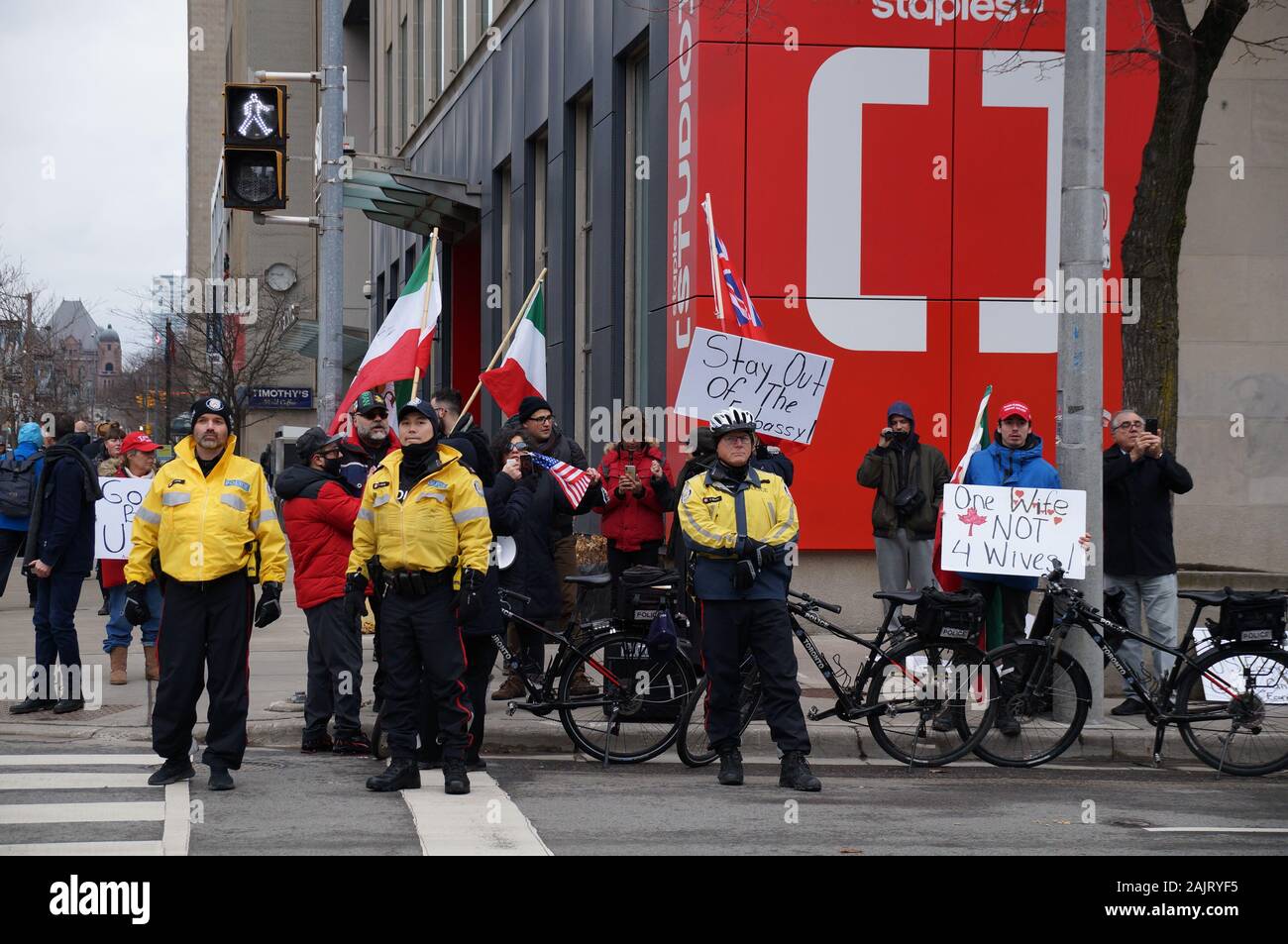 TORONTO, CANADA - 01 04 2020: Police officers guarding the rally outside U.S. Consulate in Toronto supporting US President Donald Trump's policy in Stock Photo