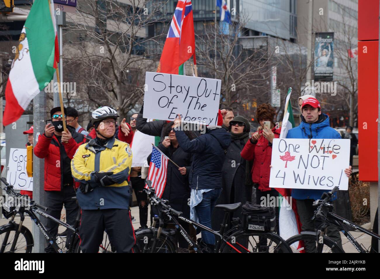 TORONTO, CANADA - 01 04 2020: Police officer guarding the rally outside U.S. Consulate in Toronto supporting US President Donald Trump's policy in Stock Photo