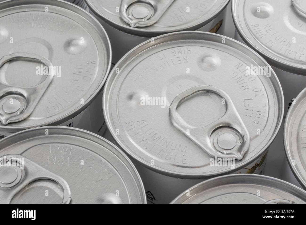 Close-up shot of brushed aluminium ring pull tab on an easy open tin of edible insects from Thailand. Metaphor ingenious, easy open food packaging Stock Photo