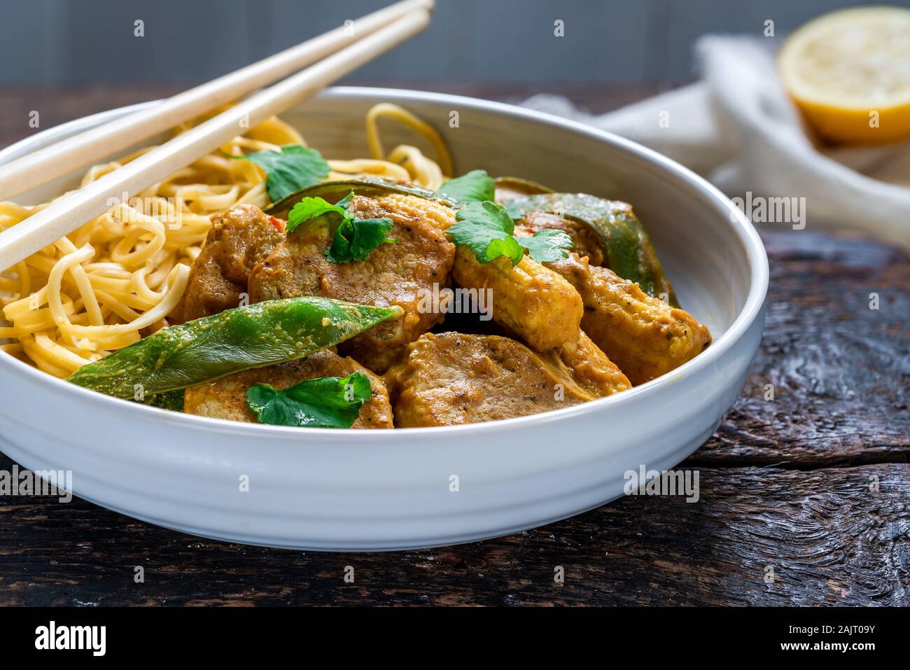 Satay pork curry with egg noodles Stock Photo Alamy