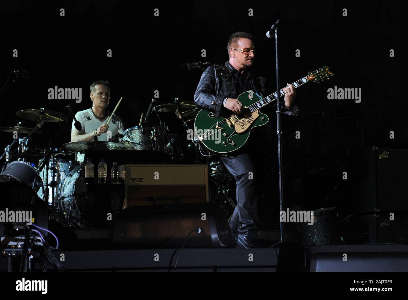 Milan Italy ,07 July 2009 ,Live concert of U2 at the Stadio Meazza San Siro : The U2 singer and guitarist Bono and drummer Larry Mullen Jr during the concert Stock Photo