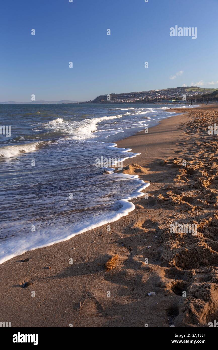 Waves and beach at Colwyn Bay, north Wales coast Stock Photo