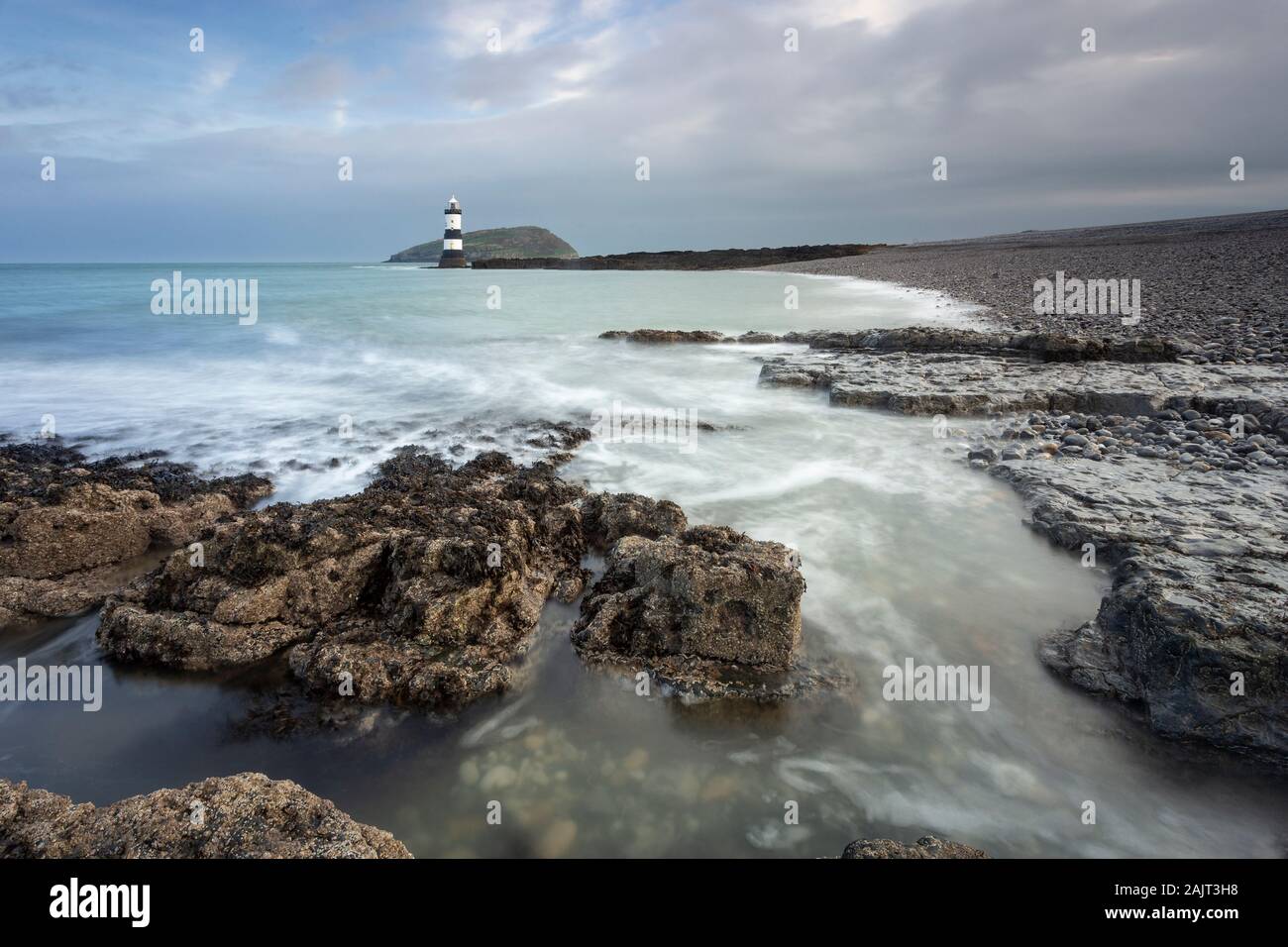 Penmon Point lighthouse and Puffin Island, Anglesey, North Wales Stock Photo