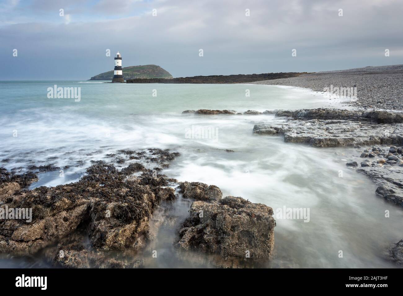 Penmon Point lighthouse and Puffin Island, Anglesey, North Wales Stock Photo
