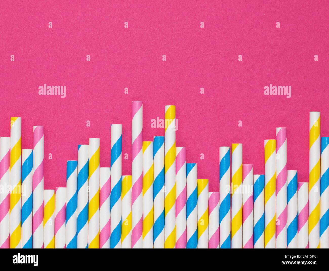 Straw Shape Border Border of paper straws with stripes against a hot pink background with ...