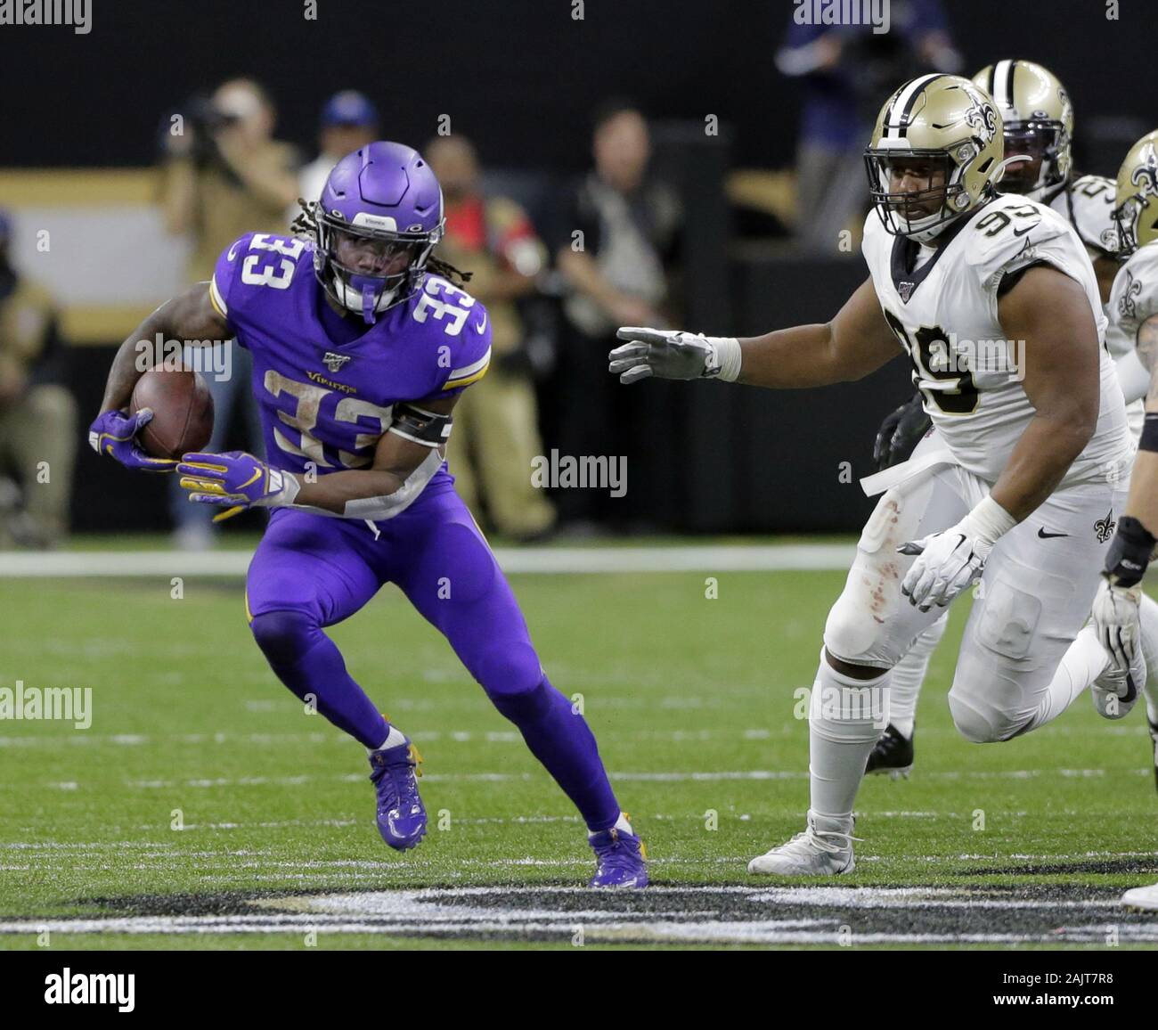New Orleans, United States. 05th Jan, 2020. Minnesota Vikings running back Dalvin Cook (33) runs past New Orleans Saints defensive tackle Shy Tuttle (99) for a 11 yard gain during overtime in the NFC Wild Card game at the at the Mercedes-Benz Superdome in New Orleans on Sunday, January 5, 2020. Photo by AJ Sisco/UPI Credit: UPI/Alamy Live News Stock Photo