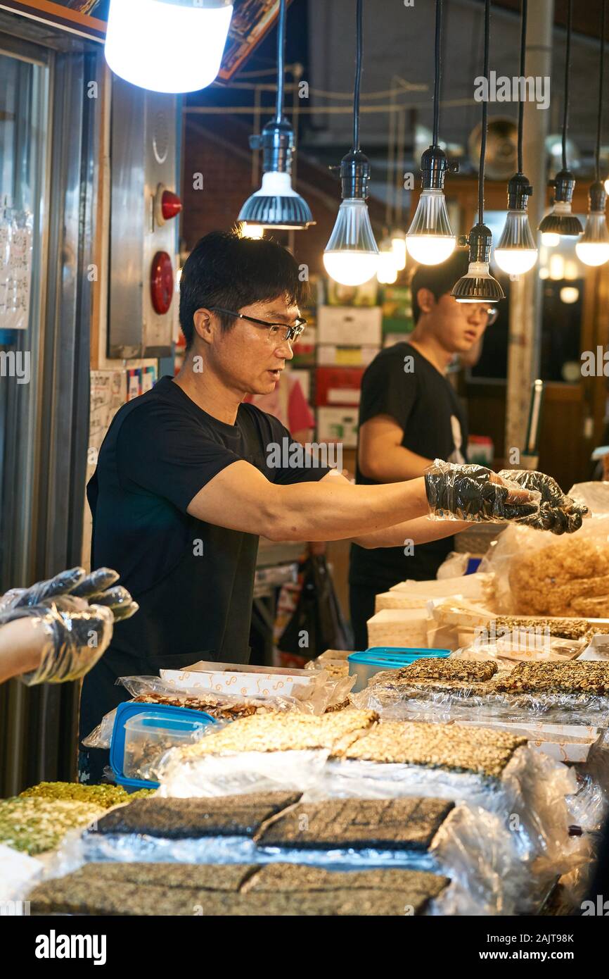 Korean male chefs prepare food for sale at Gwangjang Market in Seoul, South Korea. Stock Photo