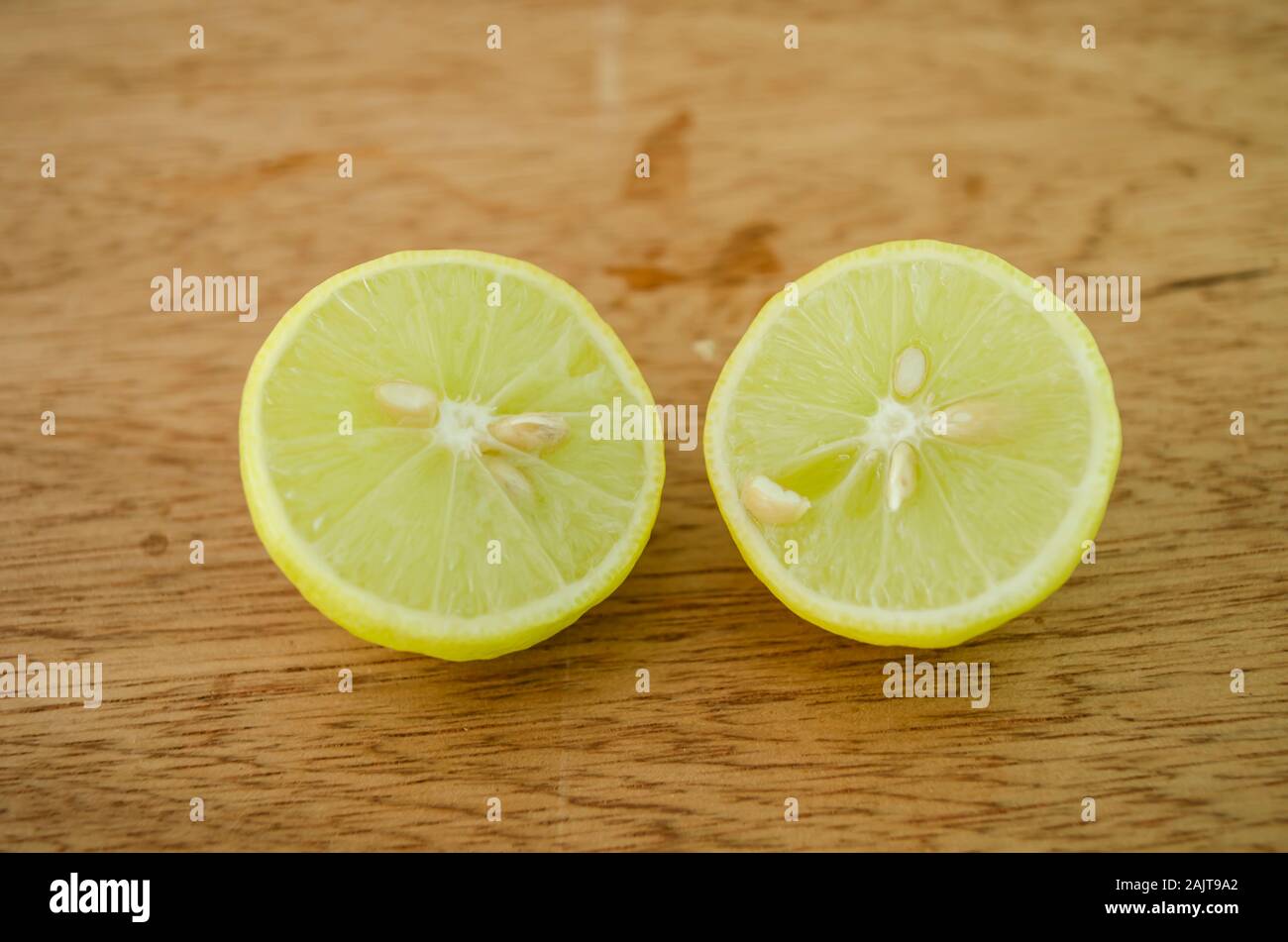 key Lime Cut In Two Showing Its Cross Section Stock Photo