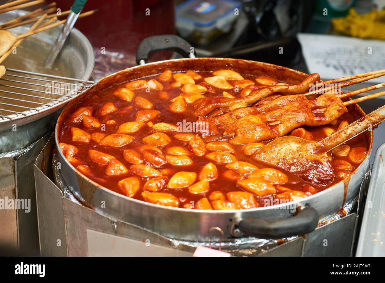 Tteokbokki spicy rice cakes in a red sauce for sale at Gwangjang Market