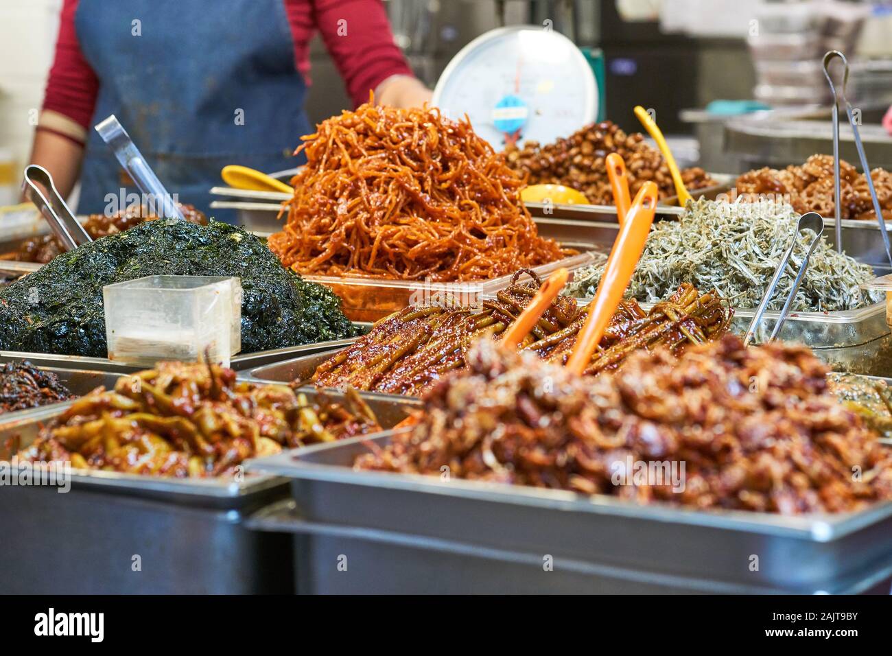Serving trays are filled with mounds of traditional Korean dishes at Gwangjang Market in Seoul