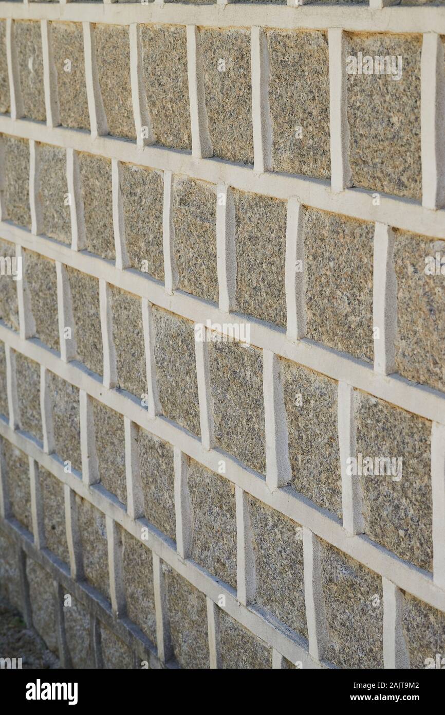 Gray stones in a simple repeating pattern on an outside wall in Gyeongbokgung Palace. Stock Photo