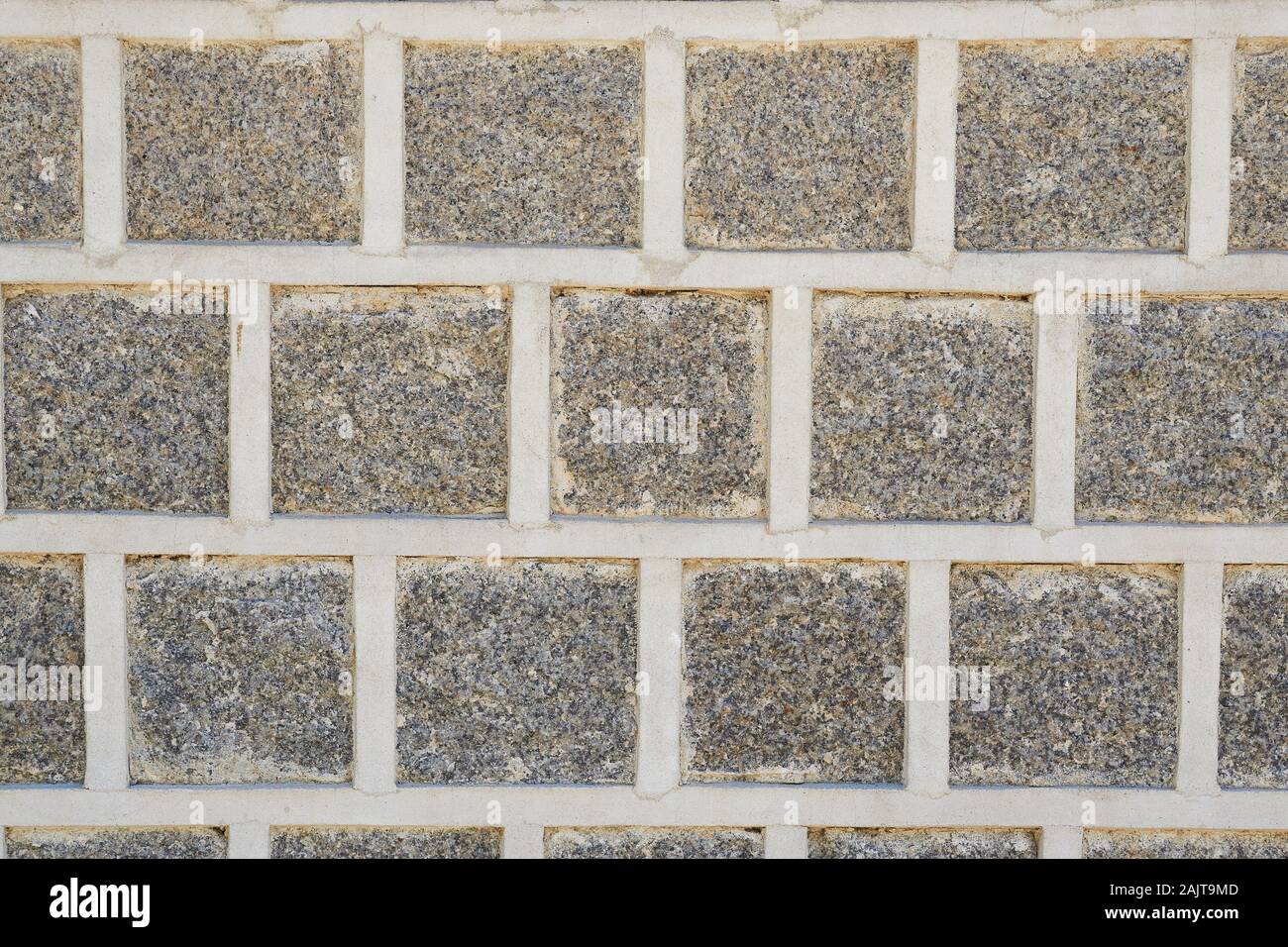 Gray stones in a simple repeating pattern on an outside wall in Gyeongbokgung Palace. Stock Photo