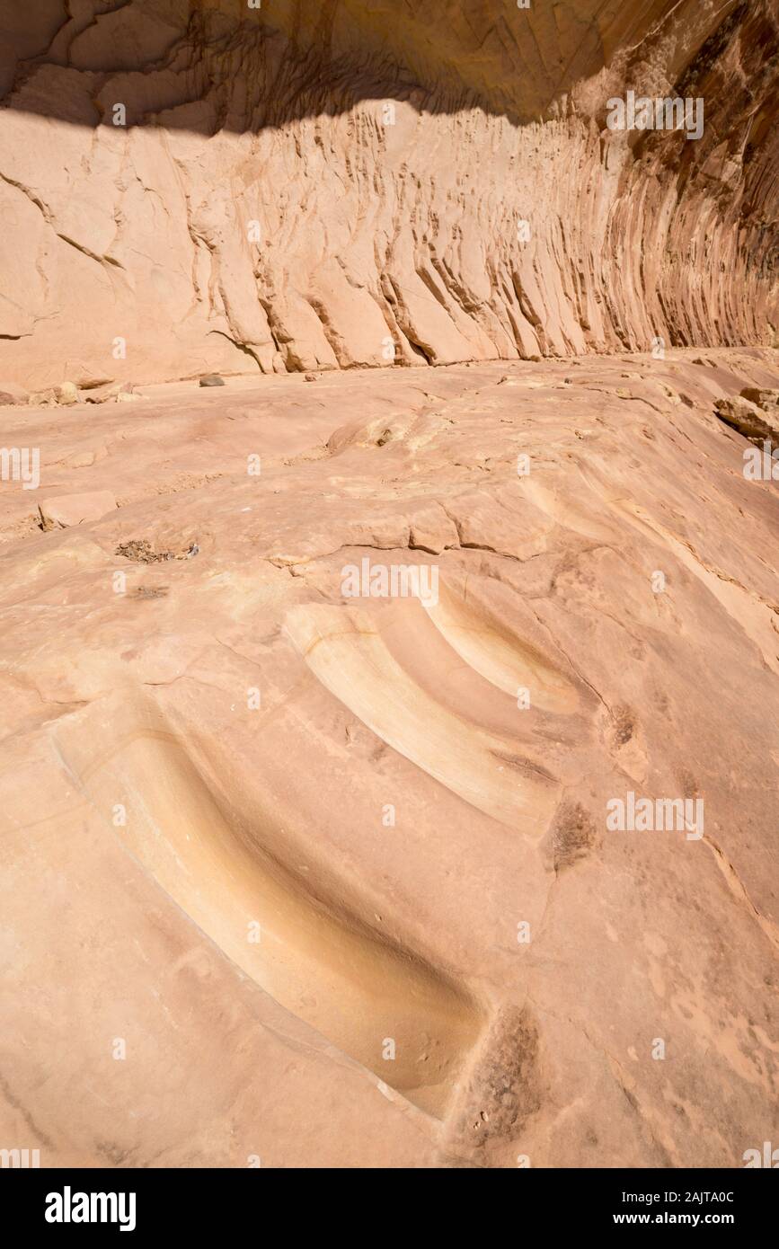 Matates in a canyon in Southern Utah.  Matates were used by native people's to grind grains and other materials. Stock Photo
