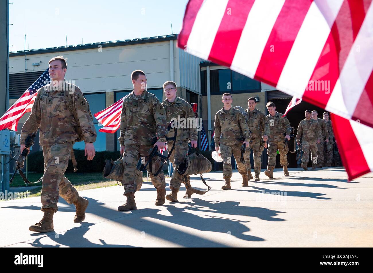 January 5, 2020, Pope Army Airfield, North Carolina, USA: U.S. Army paratroopers from the 1st Brigade Combat Team, 82nd Airborne Division, walk past members of the North Carolina Patriot Guard Riders as the division continues their deployment from Pope Army Airfield. The ''All American Division'' Immediate Response Force (IRF), based at Fort Bragg, N.C., mobilized for deployment to the U.S. Central Command area of operations in response to increased threat levels against U.S. personnel and facilities following the Jan. 2 U.S. drone strike in Baghdad, Iraq that killed Qasem Soleimani, the head Stock Photo