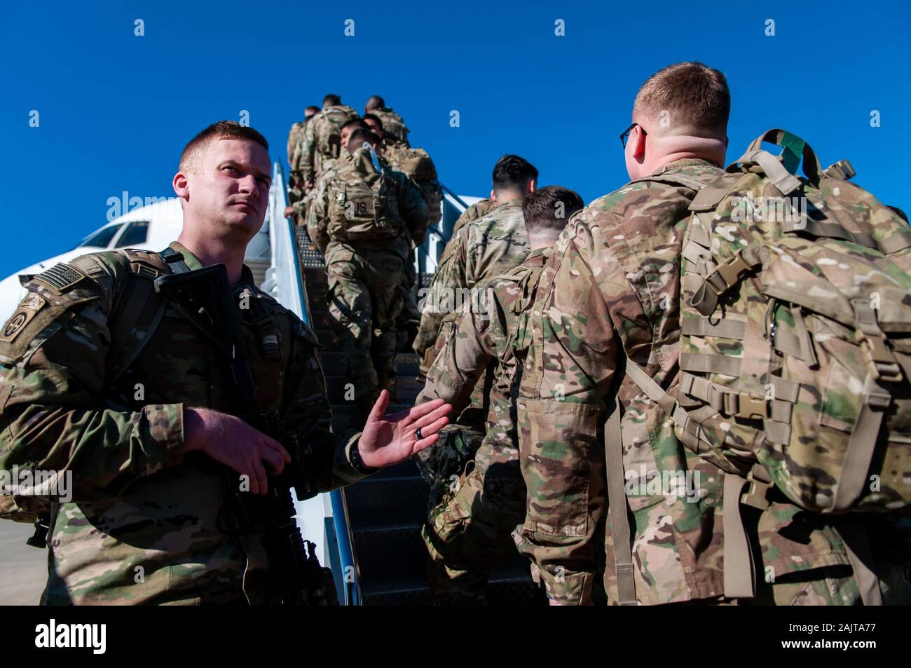 January 5, 2020, Pope Army Airfield, North Carolina, USA: U.S. Army paratroopers from the 1st Brigade Combat Team, 82nd Airborne Division, board an aircraft at Pope Army Airfield for deployment to the U.S. Central Command area of operations in response to increased threat levels against U.S. personnel and facilities in the area. Today's deployment follows the Jan. 1 deployment of a division infantry battalion; the Jan. 2 U.S. drone strike in Baghdad, Iraq that killed Qasem Soleimani, the head of Iran's Islamic Revolutionary Guard Corps-Quds Force, and elements of the division that deployed Jan Stock Photo