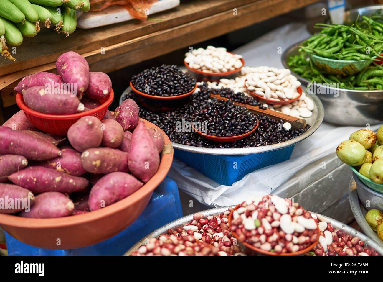 Black and white dried beans, sweet potatoes, jojoba, and other produce for sale at Gwangjang Market in Seoul, South Korea. Stock Photo