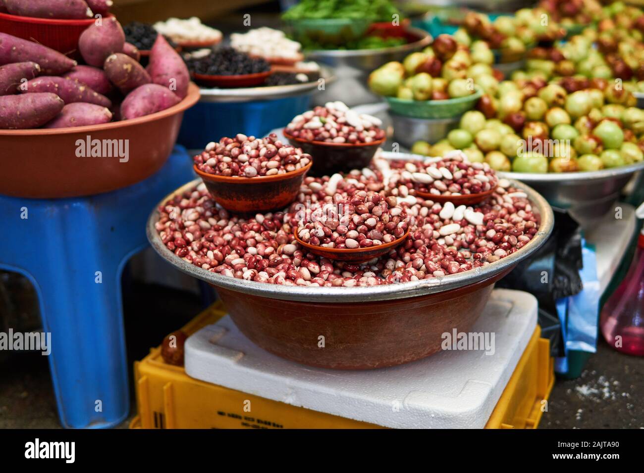 Red and white dried beans, sweet potatoes, jojoba, and other produce for sale at Gwangjang Market in Seoul, South Korea. Stock Photo