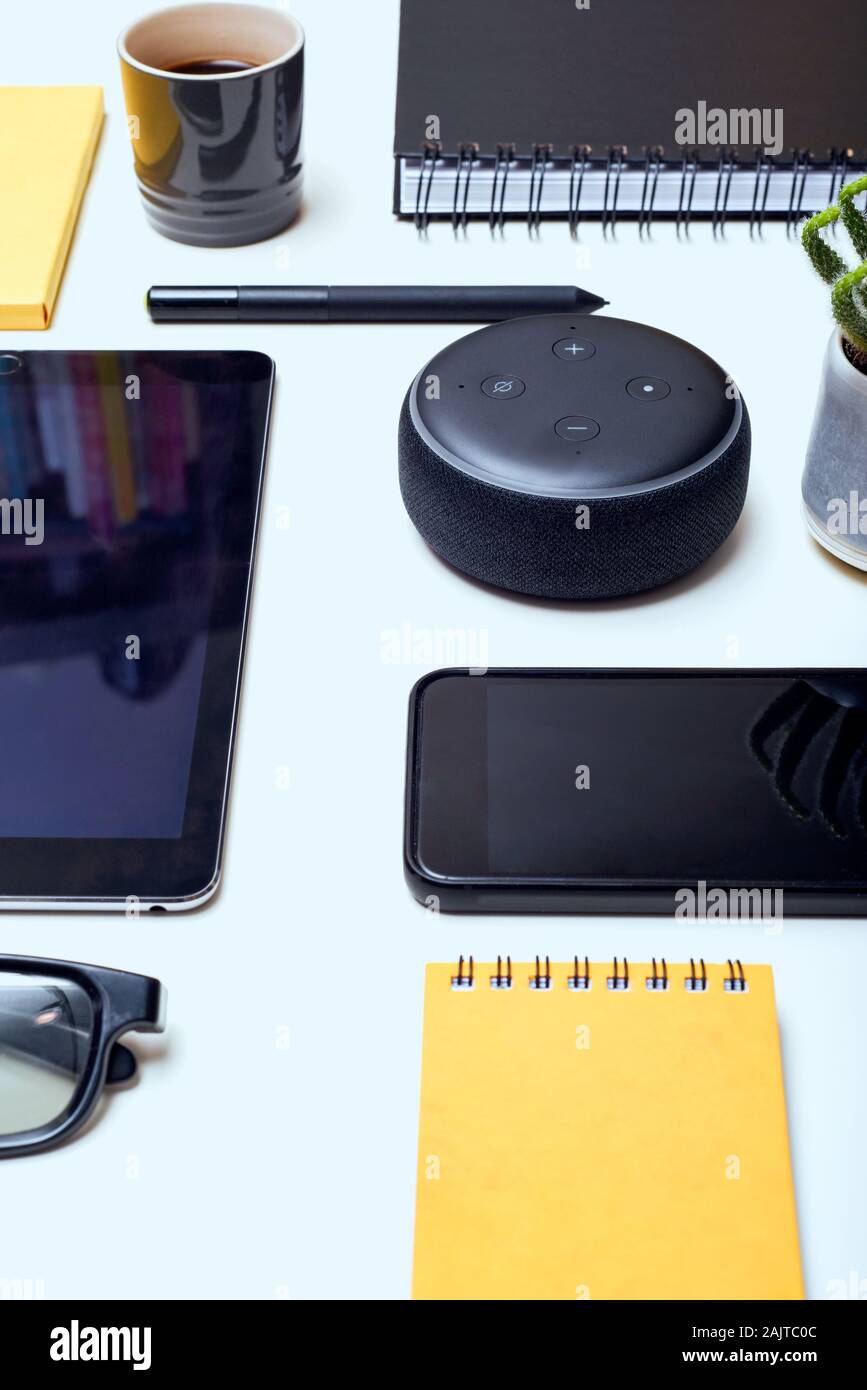 Digital And Wireless Technology Objects Arranged On A White Desk