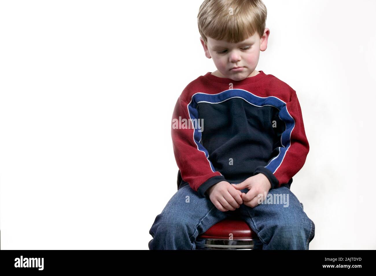 Sad little sixyearold boy with a worried expression Stock Photo Alamy