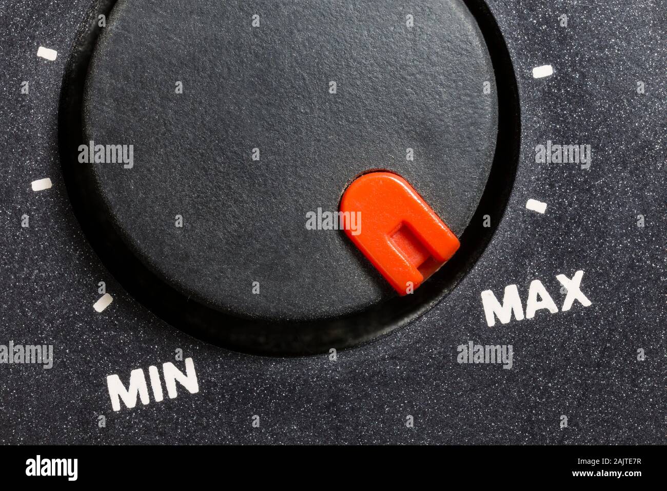 Close up macro view of vintage tape machine volume dial set to MAX. Stock Photo