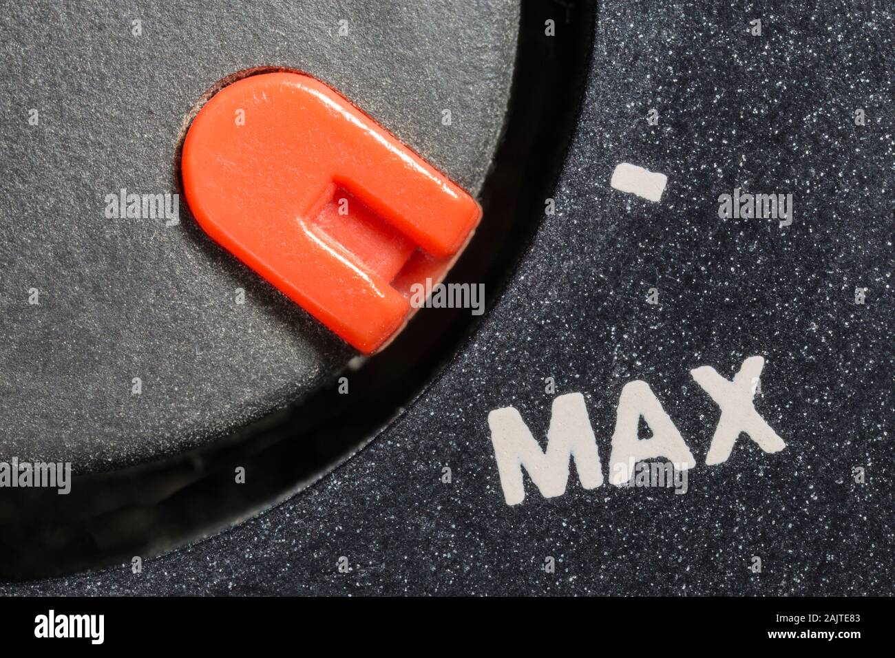 Macro close up view of vintage tape machine volume dial set to MAX. Stock Photo