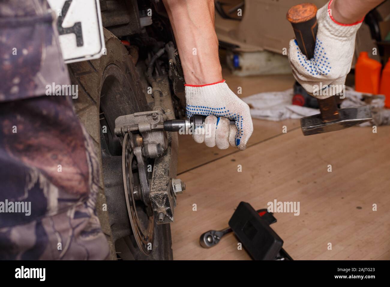 The process of replacing brake pads on a motorcycle. Maintenance