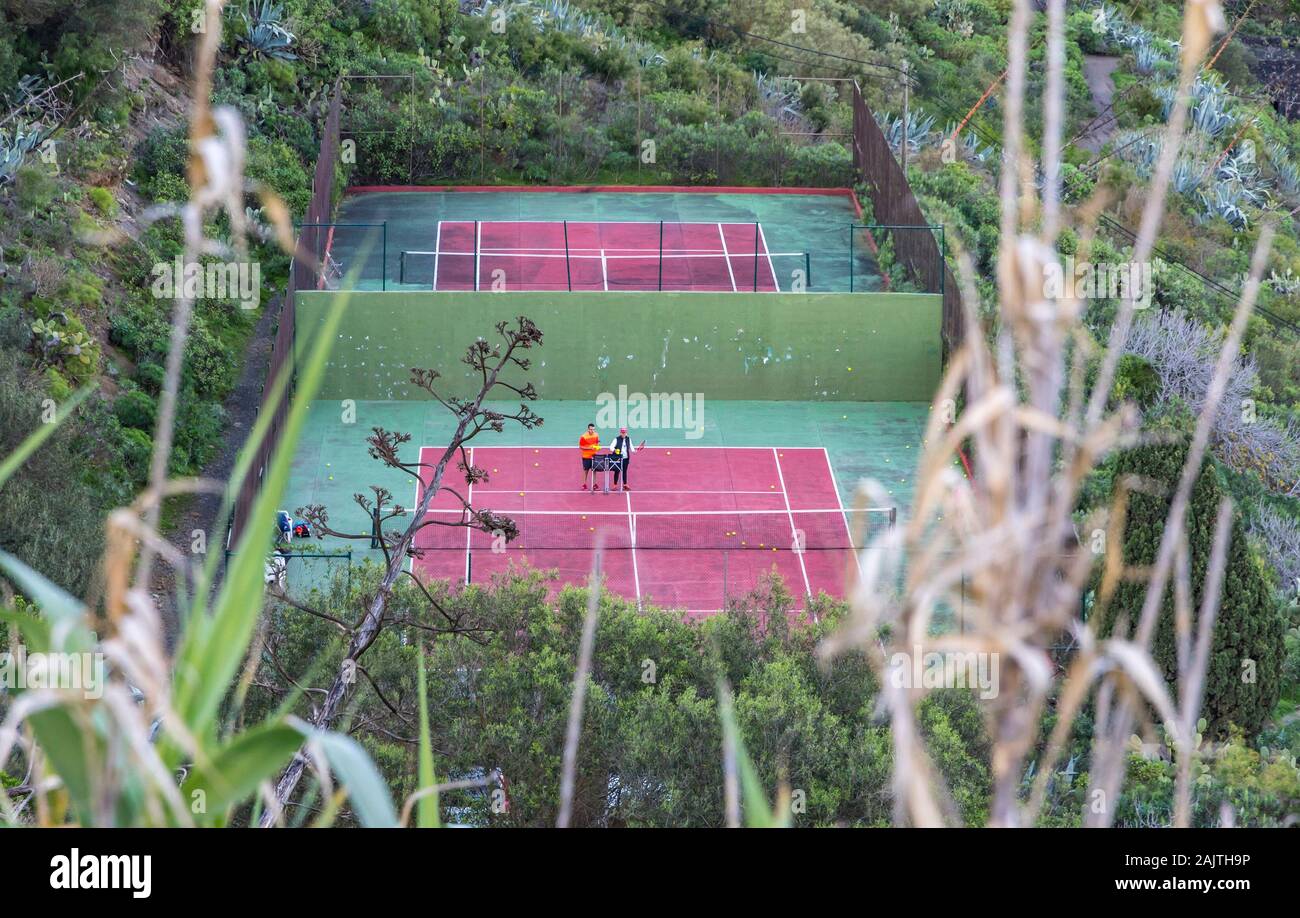 Tennis courts of the Real Club de Golf de Las Palmas seen from the streets of Santa Brigida town, Las Palmas de Gran Canaria, Spain Stock Photo