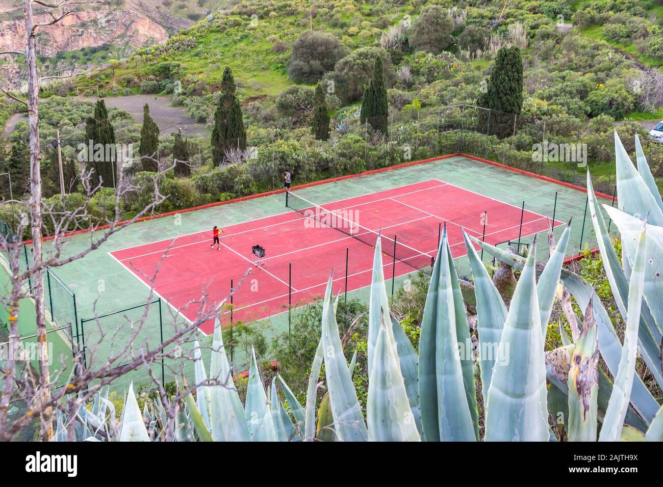 Tennis courts of the Real Club de Golf de Las Palmas seen from the streets of Santa Brigida town, Las Palmas de Gran Canaria, Spain Stock Photo