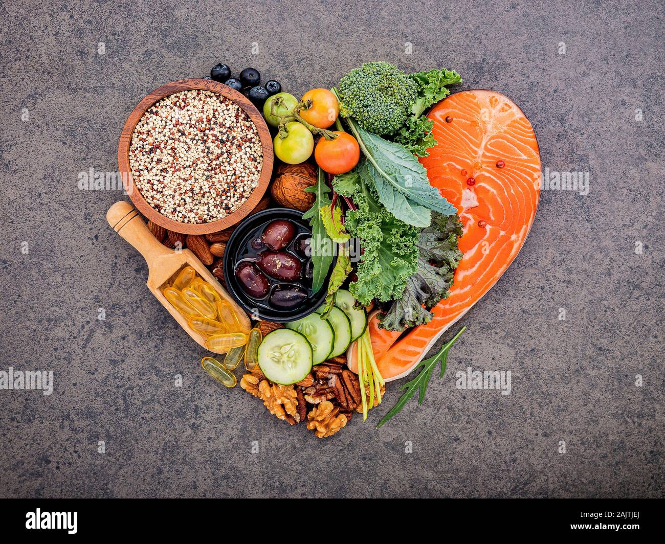 Heart shape of ketogenic low carbs diet concept. Ingredients for healthy  foods selection on dark stone background. Balanced healthy ingredients of  uns Stock Photo - Alamy