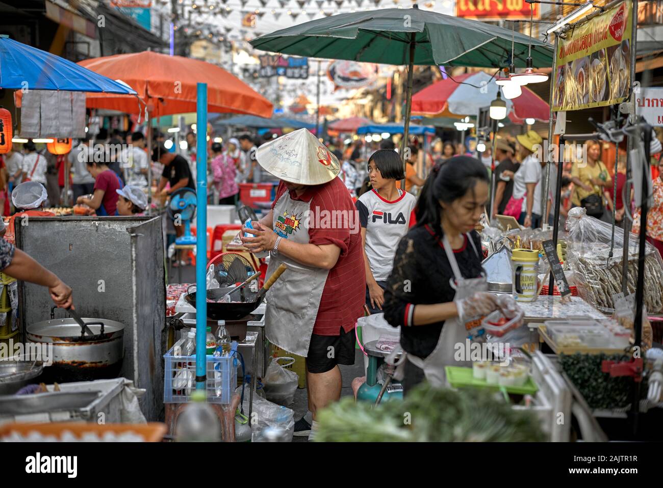 Thailand street food market and vendors behind their stalls, Na Klua