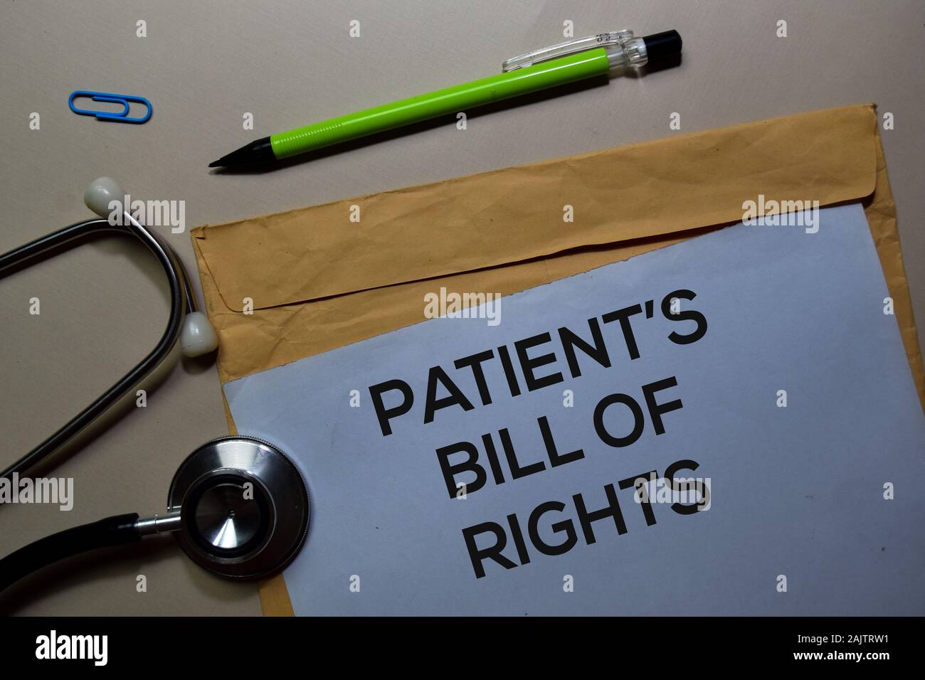 Patient s bill of rights text on document above brown envelope and