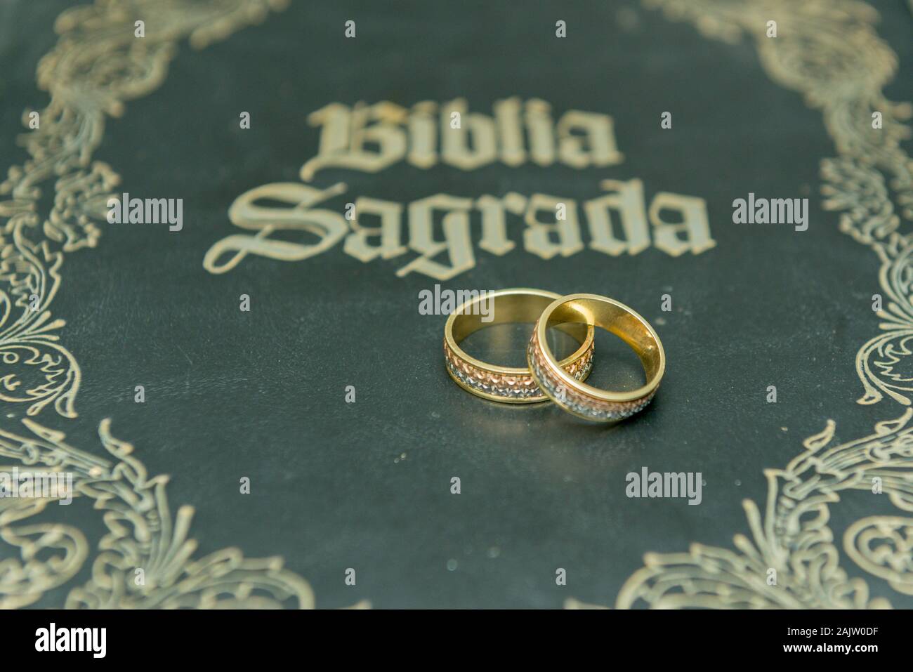 A princess cut diamond and the names of the couple engraved on the band  make this pair of rings uniquely personal - Christian Bauer