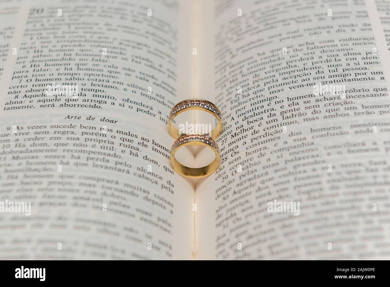 Wedding rings on a holy bible "Bíblia Sagrada". Concept of union, love,  companionship, faithfulness. Religious union. Selective focus Stock Photo -  Alamy