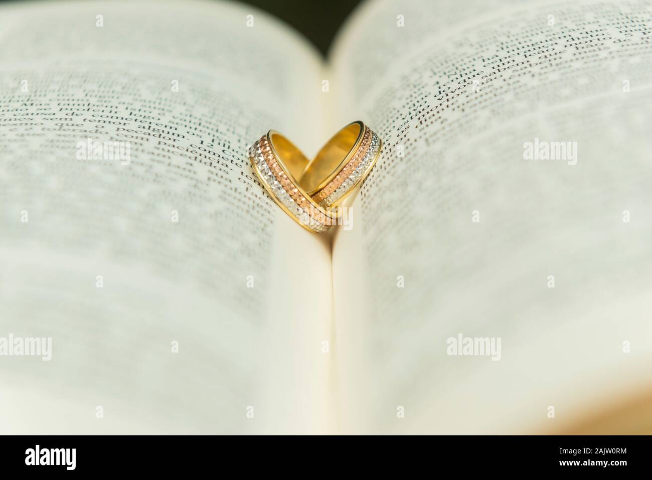 Wedding ring on open bible hires stock photography and images Alamy