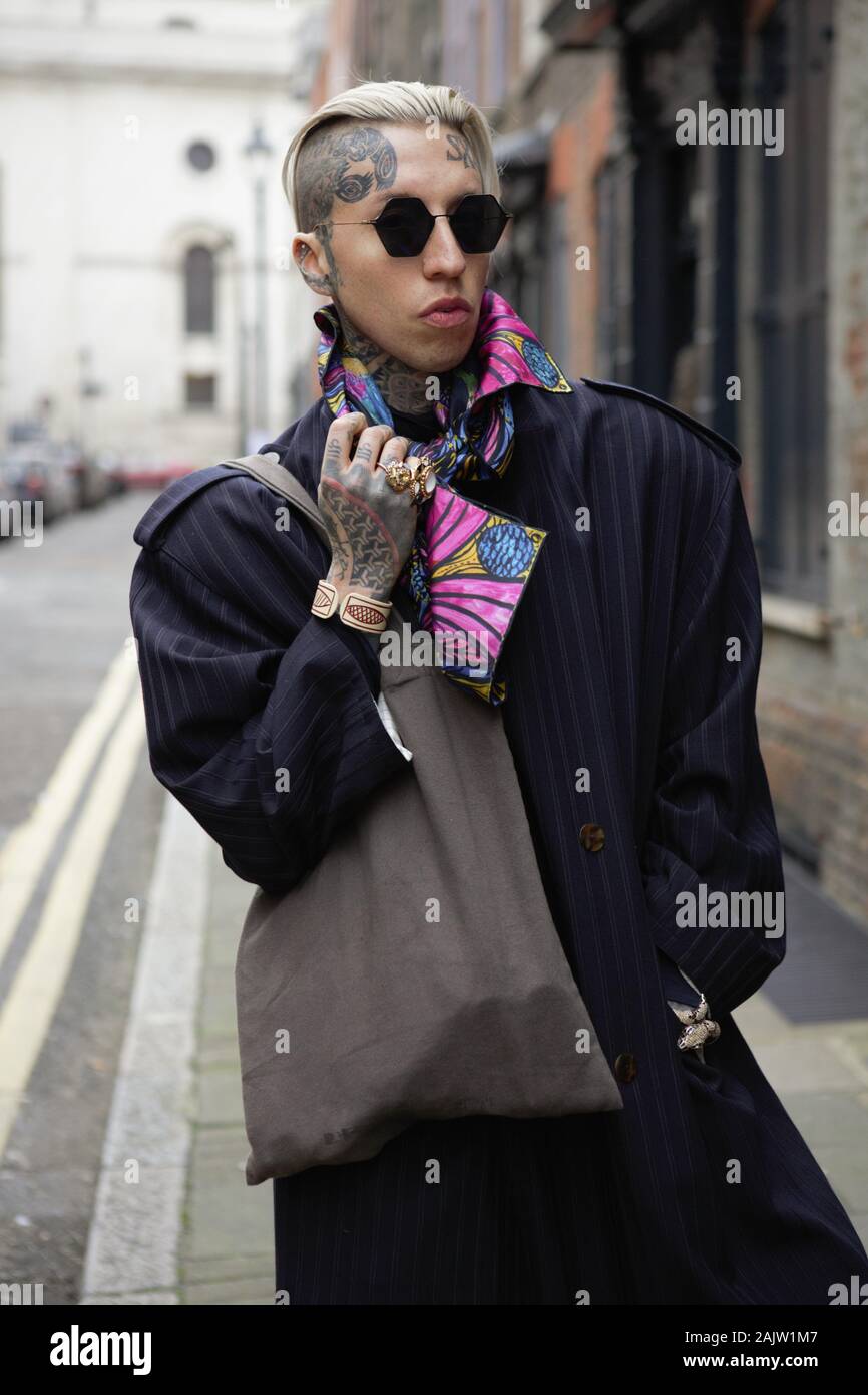 London, UK. 05th Jan, 2020. Chris Lavish wearing Yohji Yamamoto sunglasses,  Norton and Hodges scarf and Jean Paul Gaultier trench coat attends the  London Fashion Week Men's Day two Street Style. Credit: