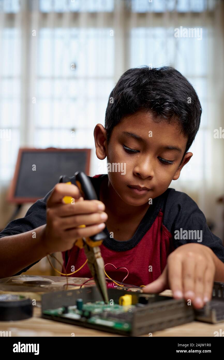 Child home repairing computer circuit hi-res stock photography and ...