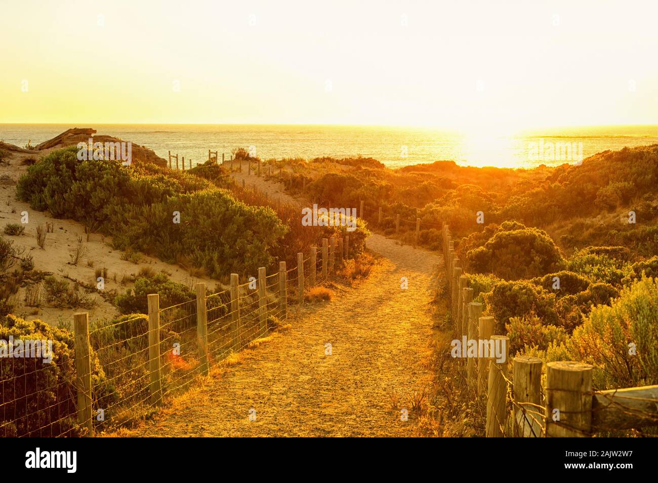 A picturesque footpath to the beach on sunset. Photo taken in South Australia. Stock Photo