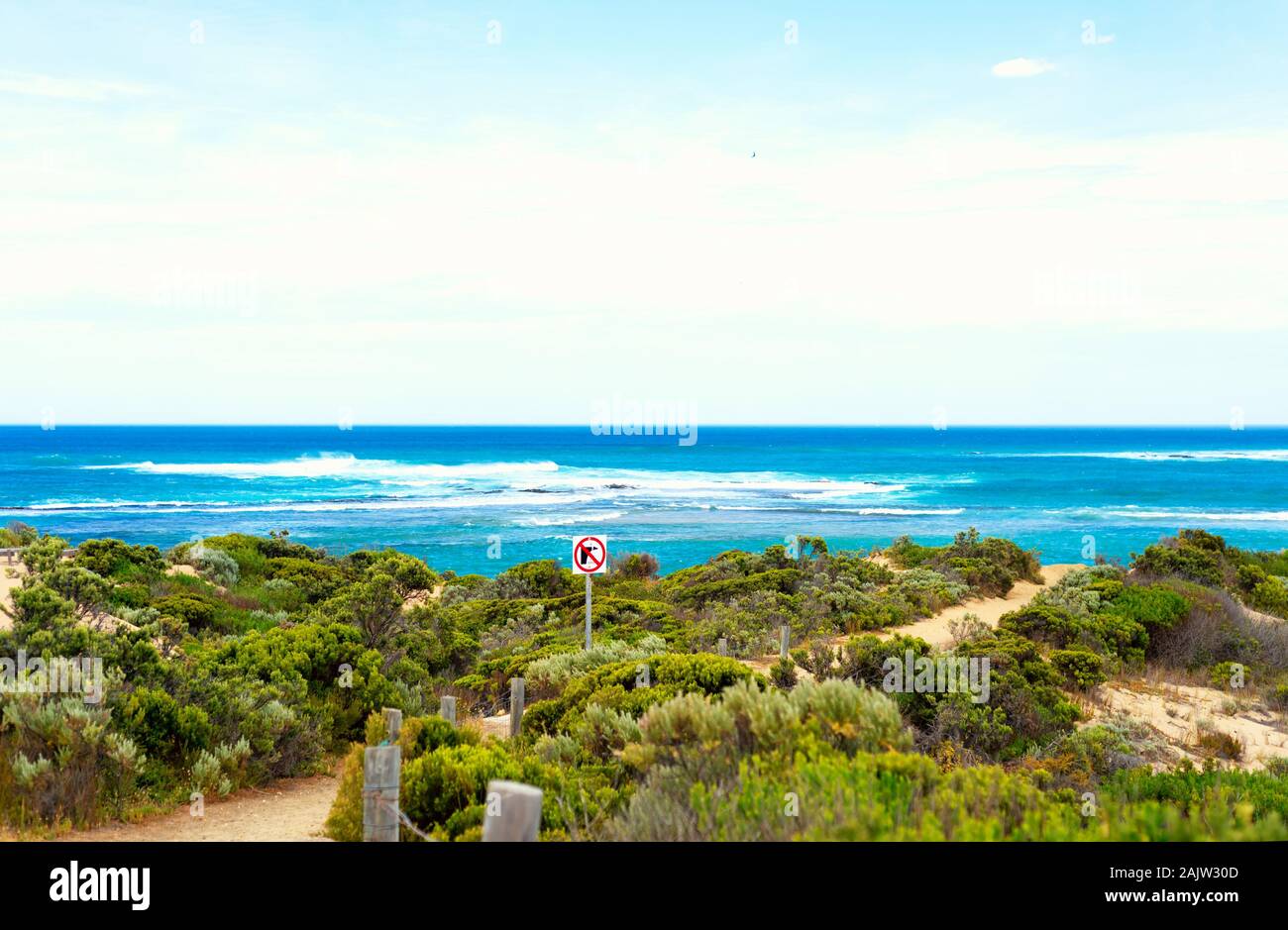 Sign 'Unstable cliffs' on a australian beach. Photo taken from Bowman scenic drive, Beachport, Australia. Stock Photo