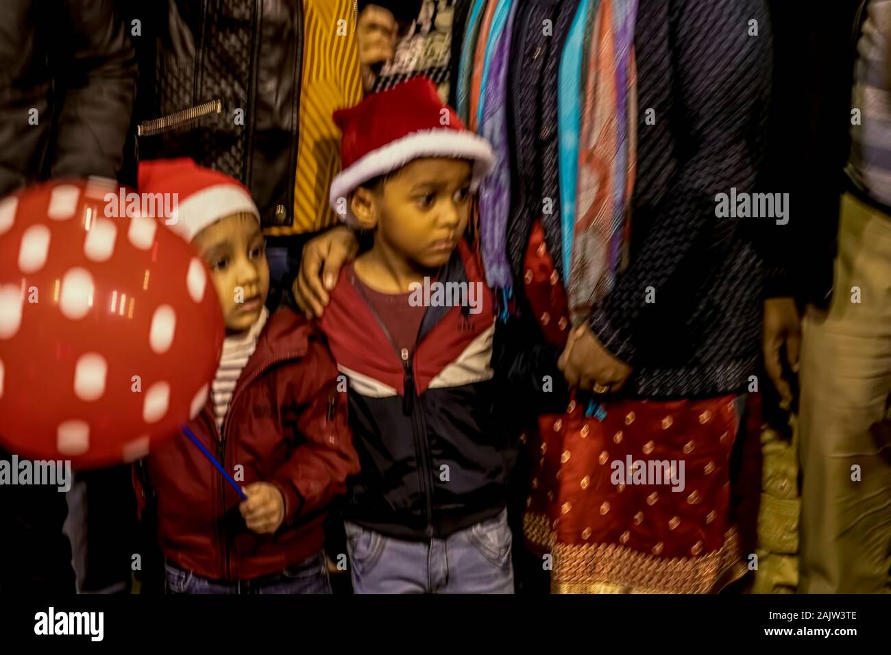 Kids,observing,Santa Claus,processsion,at Sribhumi, Kolkata,on Christmas,celebration,2019.W.B. India. Stock Photo