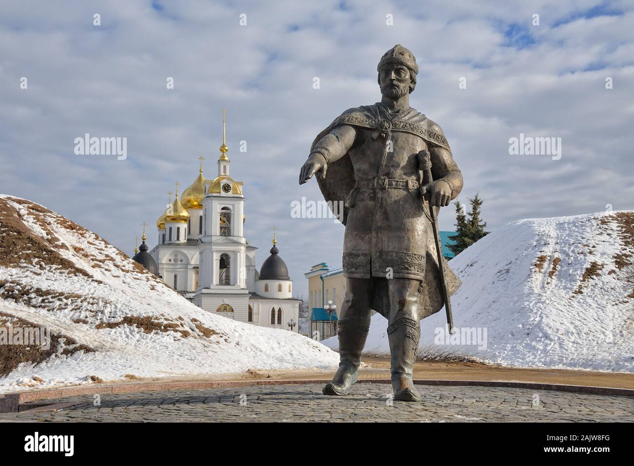 = Yuri Dolgoruky Monument at Dmitrov Kremlin in Winter Season =  Bronze monument to Prince Yuri Dolgoruky in winter against the background of the sout Stock Photo