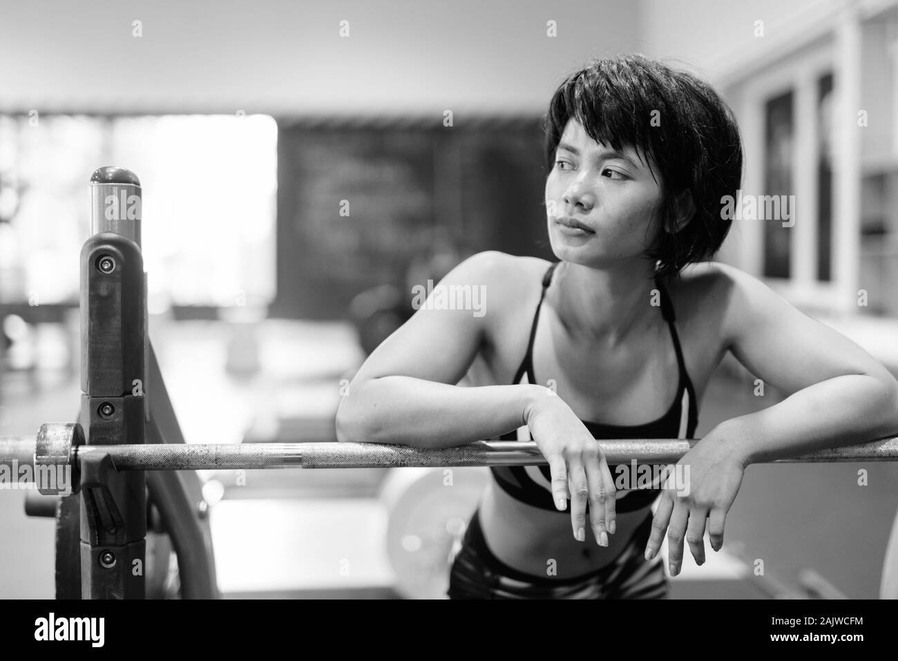 Young beautiful Asian woman working out at the gym Stock Photo - Alamy