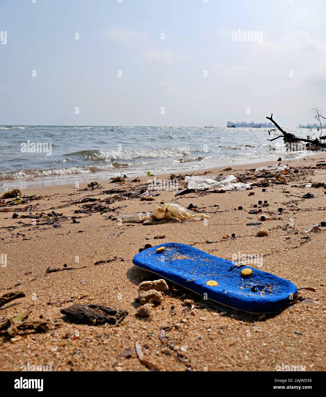 washed up flipflop on beach in Vietnam Stock Photo Alamy