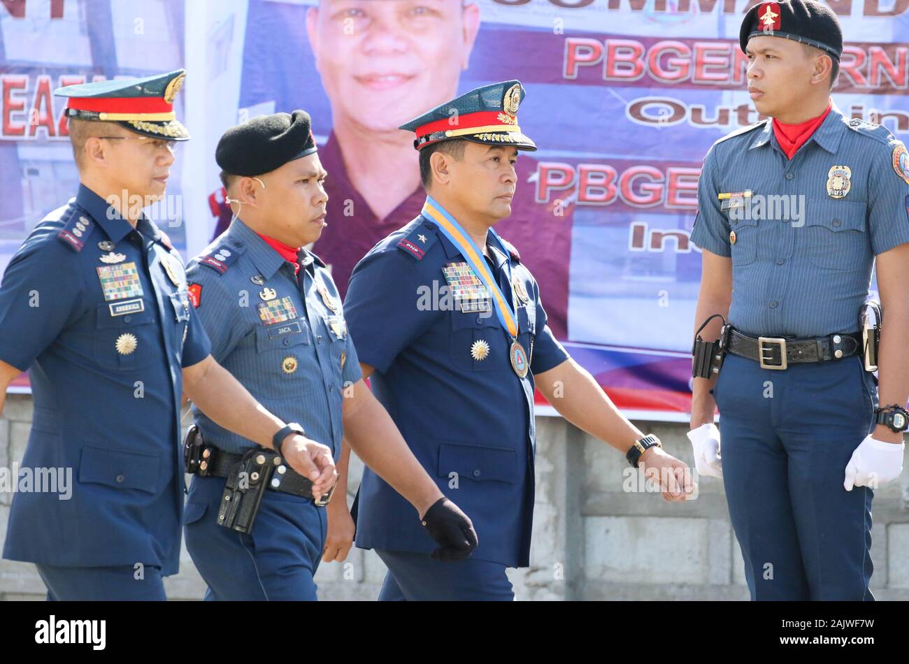 Pasay City, Philippines. 05th Jan, 2020. (L) PCOL COSME A ABRENICAChief of Staff AVSEGROUP, (2nd L) PLTCOL JACA troop commander, (C) Director of AVSEGROUP, POLICE BRIGADIER GENERAL CRIZALDO O NIEVES during turn over of command of outgoing PNP (Philippine National Police) - AVSEGROUP (Aviation Security Group) Director PBGEN ARNEL ESCOBAL at PNP-AVSEGROUP Head Quarters, NAIA Complex. (*Photo by Herman R. Lumanog/Pacific Press) Credit: Pacific Press Agency/Alamy Live News Stock Photo