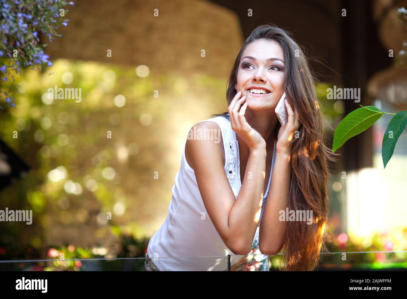 Close Up Of A Attractive Young Woman Speaking On Mobile Phone Stock Photo