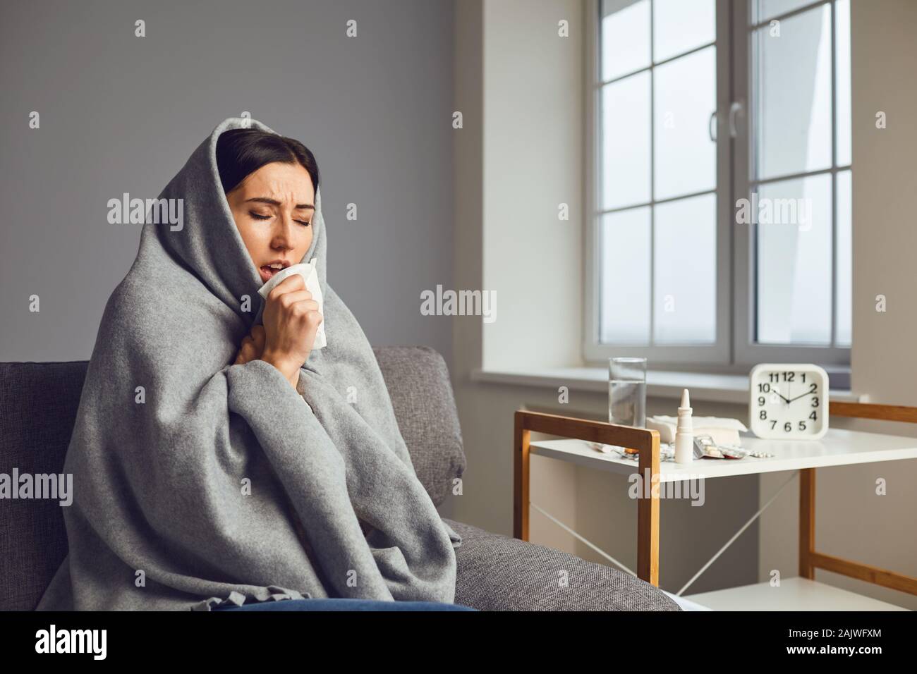 Sick girl with flu common cold flu symptoms in room at home Stock Photo