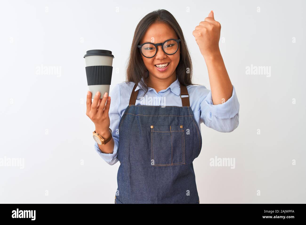 Young chinese barista woman wearing glasses holding coffee over isolated white background annoyed and frustrated shouting with anger, crazy and yellin Stock Photo