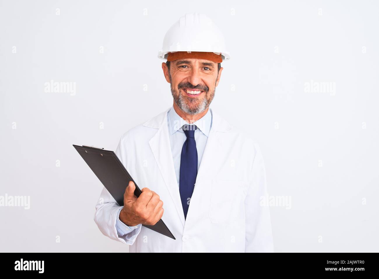 Senior engineer man wearing security helmet holding clipboard over ...