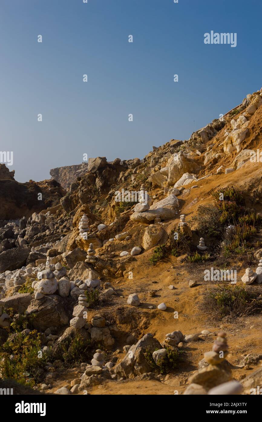 Beach with stacks of rocks called a cairns. Peniche Portugal Stock Photo Alamy